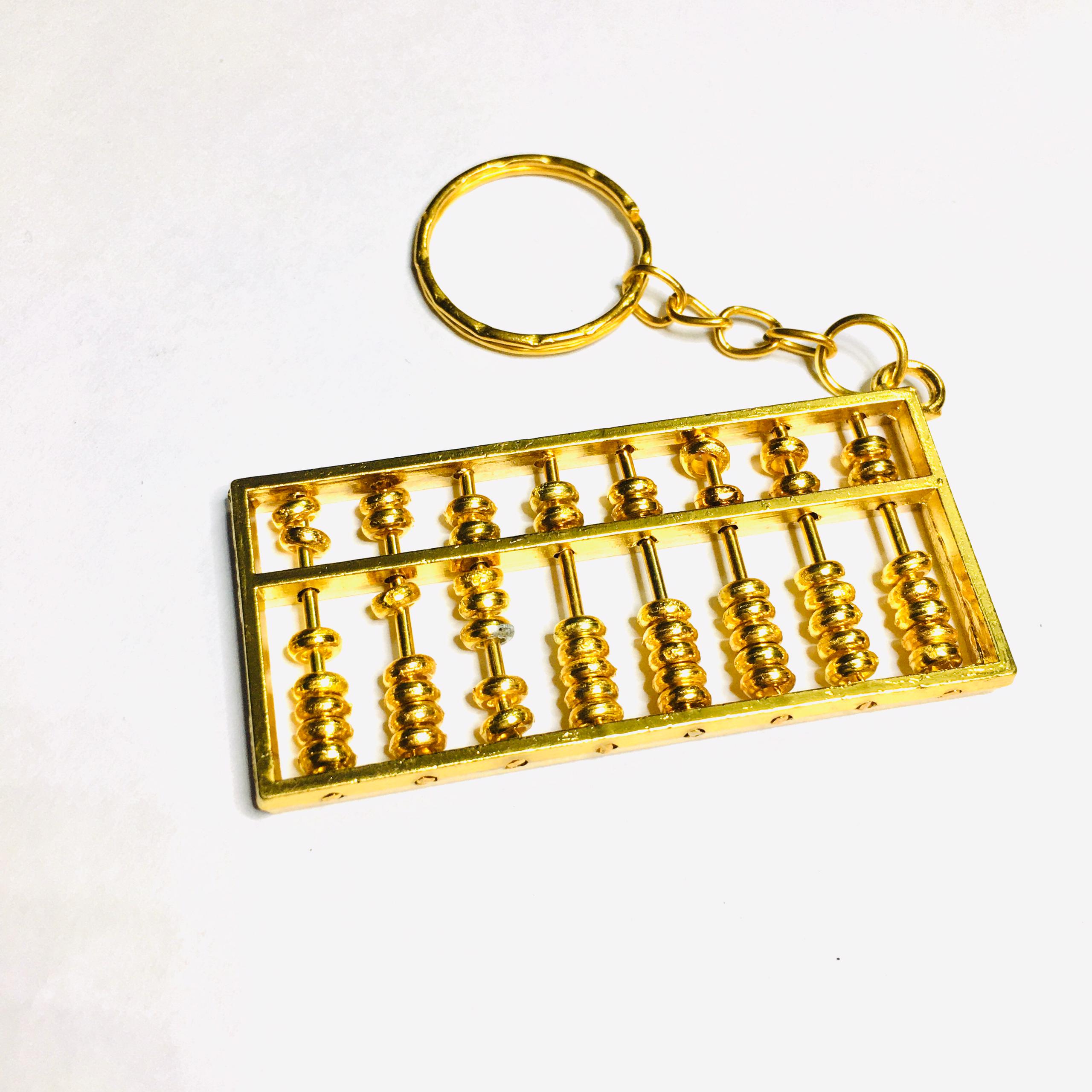 جاسوئیچی چرتکه فلزی طلایی سایز کوچک با مهره های متحرک