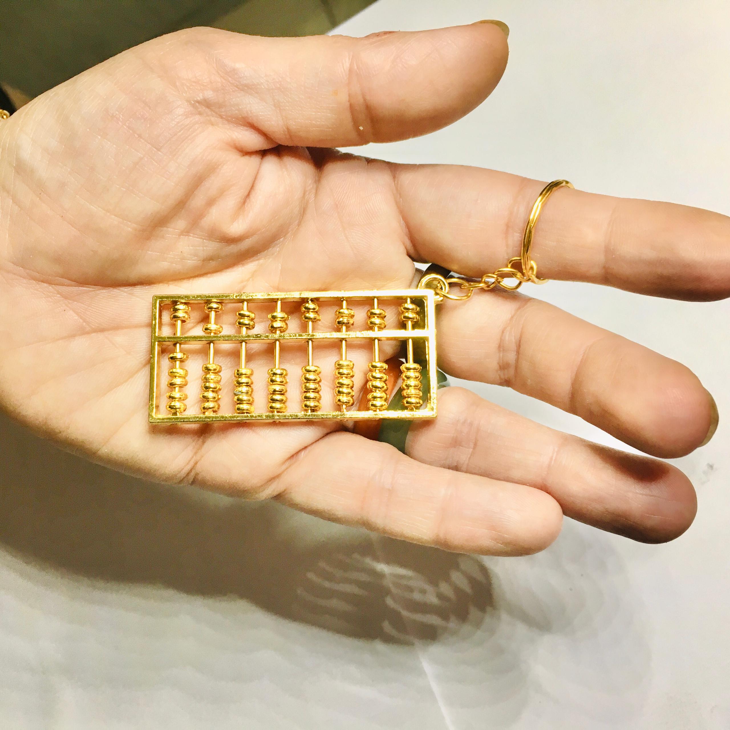 جاسوئیچی چرتکه فلزی طلایی سایز کوچک با مهره های متحرک